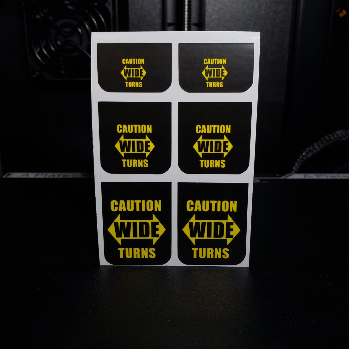 1/25 Caution Wide Turns on Black MudFlap